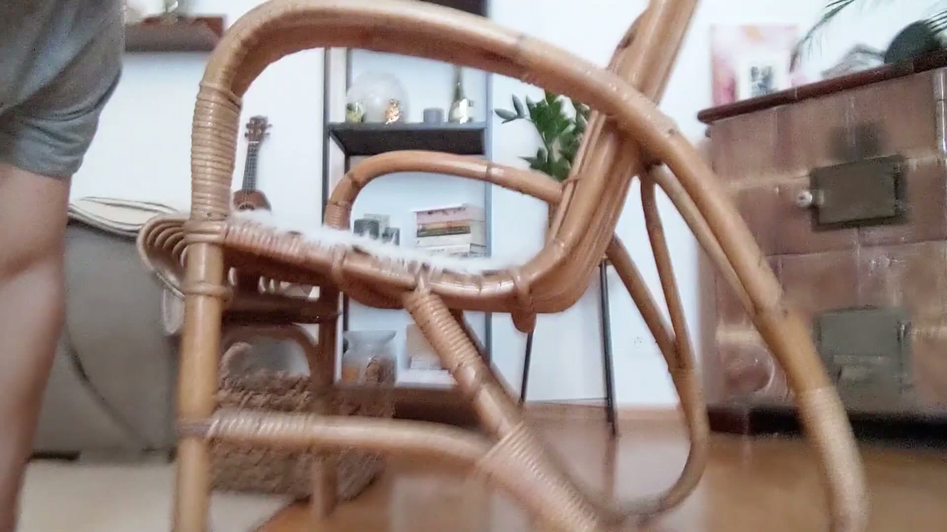 Side angle of the reference chair showing the curved frame profile.