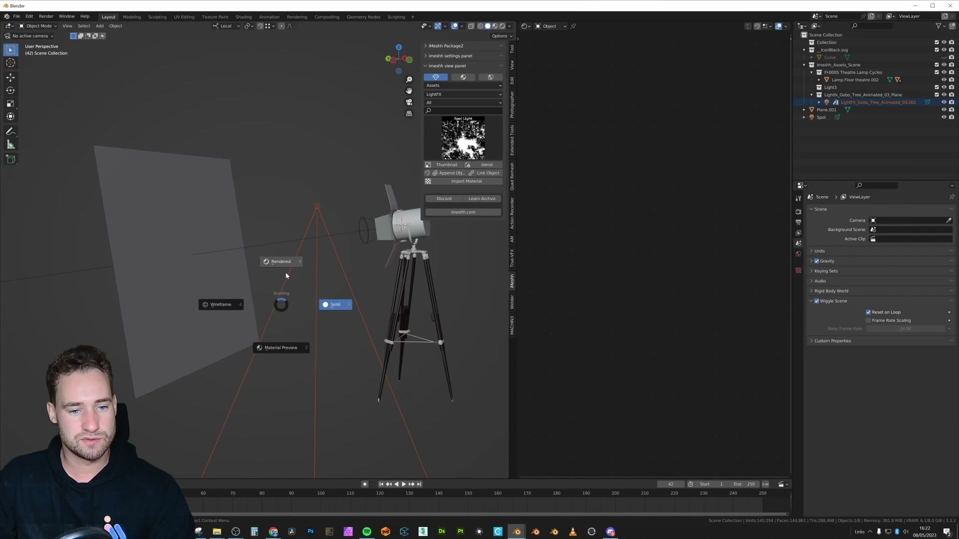 Rendered viewport with the appended gobo spotlight aimed at the back wall. Colour, intensity and size are all live-editable like any normal Blender lamp.