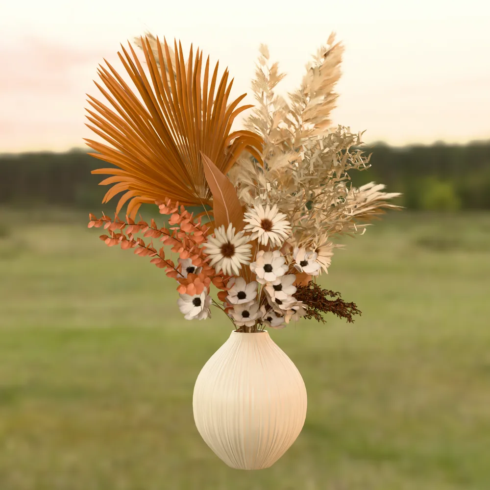 Dried flower bouquet with fan palms and pampas grass in a ribbed vase, path traced against a sunset meadow HDRI background