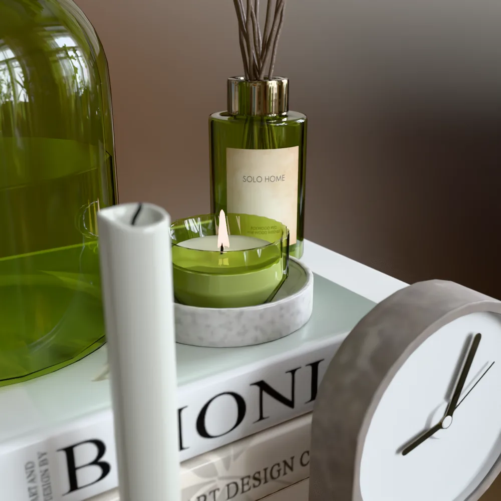 Green glass decor set with a reed diffuser, tealight and desk clock path traced in the browser, showing refraction and clean label rendering